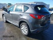 ✅ 2014 Mazda CX-5 Sport • VIN: JM3KE2BE0E0339810 • Lot: 43657362. Listed on IAAI with 198,849 mi. Free auction sales archive from the USA and detailed vehicle history report at DreamBid. Image 3.