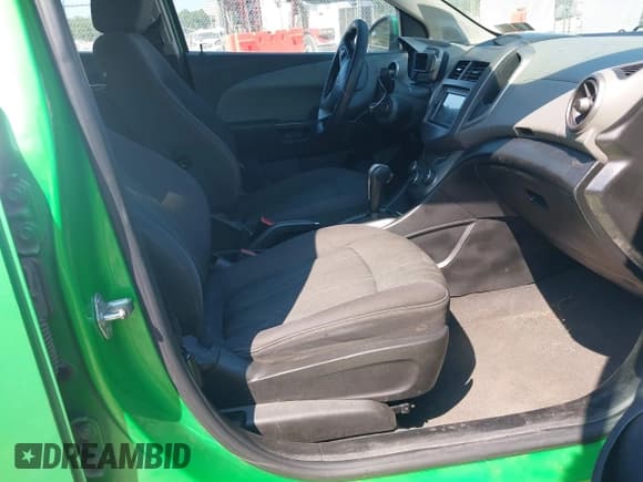 ✅ 2014 Chevrolet Sonic LT • VIN: 1G1JC5SH9E4224940 • Lot: 43197953. Listed on IAAI with 128,391 mi. Free auction sales archive from the USA and detailed vehicle history report at DreamBid. Image 5.