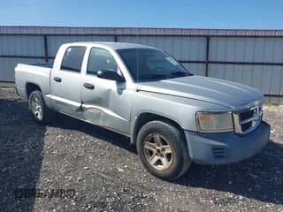 2008 Dodge Dakota SXT with VIN 1D7HE38K58S581304, listed as a IAAI auction lot 42804929 with 257,211 mi miles and . Bid and sale history available at DreamBid. Image 1.