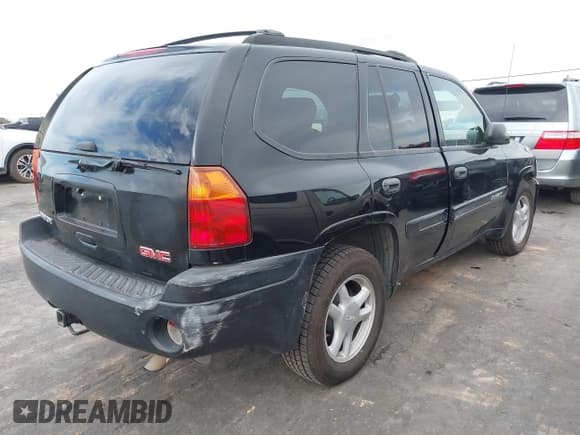 ✅ 2004 GMC Envoy SLE • VIN: 1GKDT13SX42295375 • Lot: 43680406. Listed on IAAI with 92,447 mi. Free auction sales archive from the USA and detailed vehicle history report at DreamBid. Image 4.