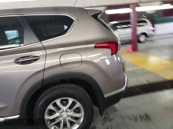✅ 2019 Hyundai Santa Fe SE • VIN: 5NMS2CAD4KH092982 • Lot: 70875062. Wystawiony na Copart z przebiegiem 107 862 mil. Bezpłatny archiwum sprzedaży aukcyjnych z USA i szczegółowy raport historii pojazdu na DreamBid. Zdjęcie 12.