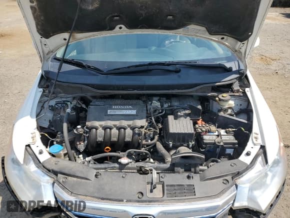 ✅ 2013 Honda Insight LX • VIN: JHMZE2H54DS006834 • Лот: 70261195. Опубликован ранее на Copart с пробегом 105 958 миль. Бесплатный доступ к архиву аукционных продаж из США и подробный отчёт об истории автомобиля на DreamBid. Изображение 11.