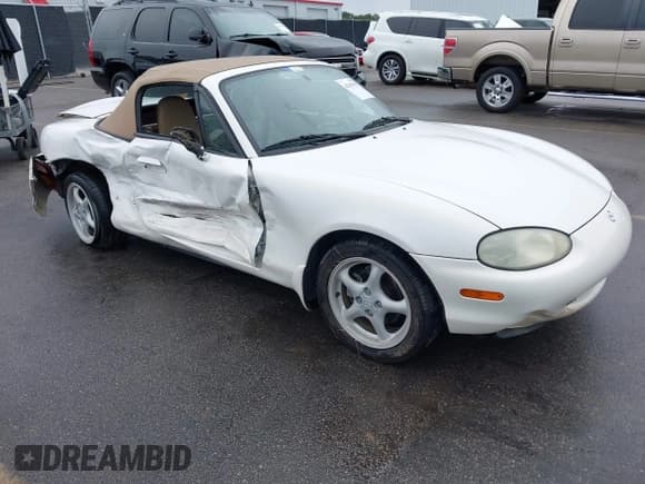 ✅ 1999 Mazda MX-5 Miata • VIN: JM1NB3530X0126910 • Lot: 43367951. Listed on IAAI with 123,521 mi. Free auction sales archive from the USA and detailed vehicle history report at DreamBid. Image 1.