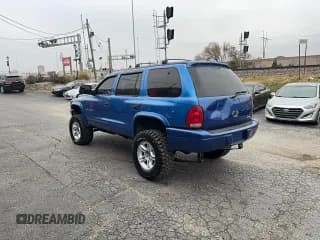 ✅ 1999 Dodge Durango • VIN: 1B4HS28Y6XF547345 • Lot: 93837545. Listed on Copart with 127,696 mi. Free auction sales archive from the USA and detailed vehicle history report at DreamBid. Image 3.