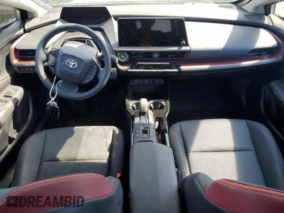 2024 Toyota Prius SE с VIN JTDACACU2R3035327, выставлен на аукционе Copart как лот 69905855 с пробегом Не указан миль и Списание • Salvage title. История ставок и продаж доступна на DreamBid. Изображение 8.