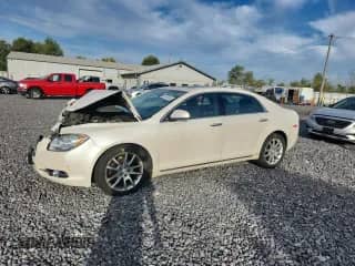 2012 Chevrolet Malibu LTZ with VIN 1G1ZG5E74CF284815, listed as a Copart auction lot 81940285 with 119,577 mi miles and Salvage title. Bid and sale history available at DreamBid. Image 1.