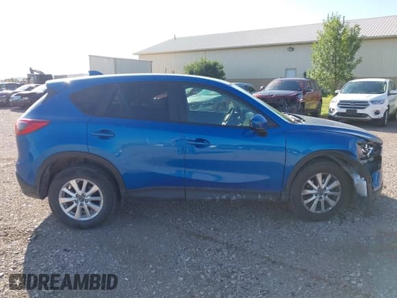 ✅ 2013 Mazda CX-5 Touring • VIN: JM3KE4CE8D0102801 • Lot: 43206563. Listed on IAAI with 149,282 mi. Free auction sales archive from the USA and detailed vehicle history report at DreamBid. Image 13.