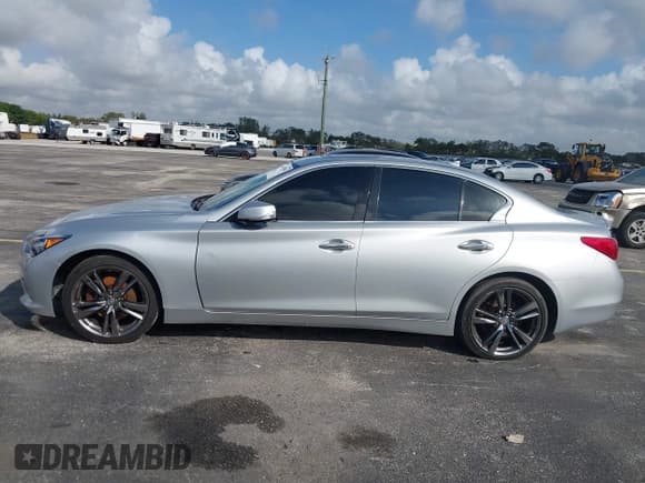 ✅ 2014 Infiniti Q50 Premium • VIN: JN1BV7AR9EM707505 • Лот: 41479683. Опубликован ранее на IAAI с пробегом 129 248 миль. Бесплатный доступ к архиву аукционных продаж из США и подробный отчёт об истории автомобиля на DreamBid. Изображение 14.