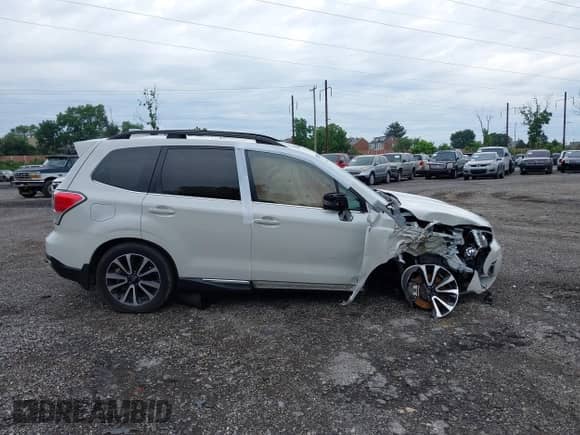 2018 Subaru Forester Touring z VIN JF2SJGWC3JH607000, wystawiony jako IAAI lot #42664722 z przebiegiem 30 857 mil mil oraz . Historia ofert i sprzedaży dostępna na DreamBid. Obrazek 13.