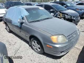 2003 Hyundai Accent GL с VIN KMHCG45C73U471607, выставлен на аукционе Copart как лот 58813445 с пробегом 222 326 миль миль и На запчасти • Non repairable. История ставок и продаж доступна на DreamBid. Изображение 4.