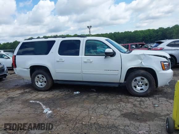2014 Chevrolet Suburban LT z VIN 1GNSCJE07ER211222, wystawiony jako IAAI lot #42428084 z przebiegiem 214 712 mil mil oraz . Historia ofert i sprzedaży dostępna na DreamBid. Obrazek 6.