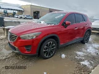 ✅ 2016 Mazda CX-5 Grand Touring • VIN: JM3KE4DY9G0748717 • Lot: 94418505. Wystawiony na Copart z przebiegiem 146 778 mil. Bezpłatny archiwum sprzedaży aukcyjnych z USA i szczegółowy raport historii pojazdu na DreamBid. Zdjęcie 1.