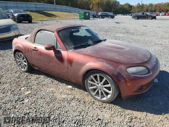 ✅ 2007 Mazda MX-5 Miata Grand Touring • VIN: JM1NC25F870128034 • Lot: 90651875. Listed on Copart with 143,059 mi. Free auction sales archive from the USA and detailed vehicle history report at DreamBid. Image 4.