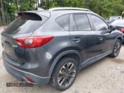 ✅ 2016 Mazda CX-5 Grand Touring • VIN: JM3KE2DY6G0840159 • Lot: 43179646. Wystawiony na IAAI z przebiegiem 71 500 mil. Bezpłatny archiwum sprzedaży aukcyjnych z USA i szczegółowy raport historii pojazdu na DreamBid. Zdjęcie 4.