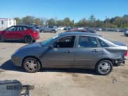 ✅ 2003 Ford Focus SE • VIN: 1FAFP34313W293846 • Lot: 43471447. Listed on IAAI with 128,750 mi. Free auction sales archive from the USA and detailed vehicle history report at DreamBid. Image 14.