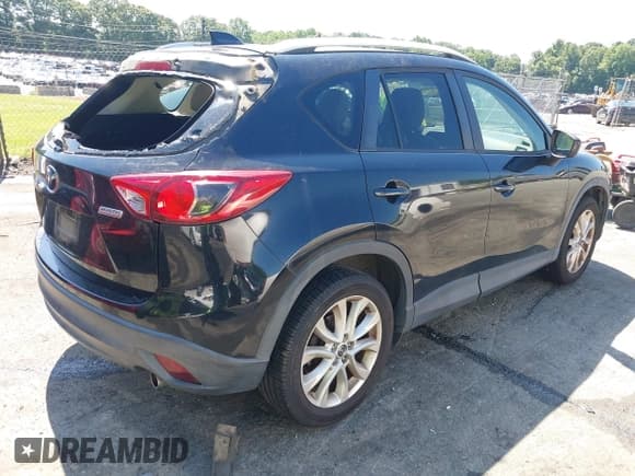 ✅ 2014 Mazda CX-5 Grand Touring • VIN: JM3KE2DY3E0339601 • Lot: 42652114. Wystawiony na IAAI z przebiegiem 153 063 mil. Bezpłatny archiwum sprzedaży aukcyjnych z USA i szczegółowy raport historii pojazdu na DreamBid. Zdjęcie 4.