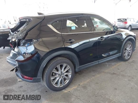 ✅ 2021 Mazda CX-5 Grand Touring • VIN: JM3KFADMXM1342413 • Lot: 41867153. Listed on IAAI with 38,519 mi. Free auction sales archive from the USA and detailed vehicle history report at DreamBid. Image 4.