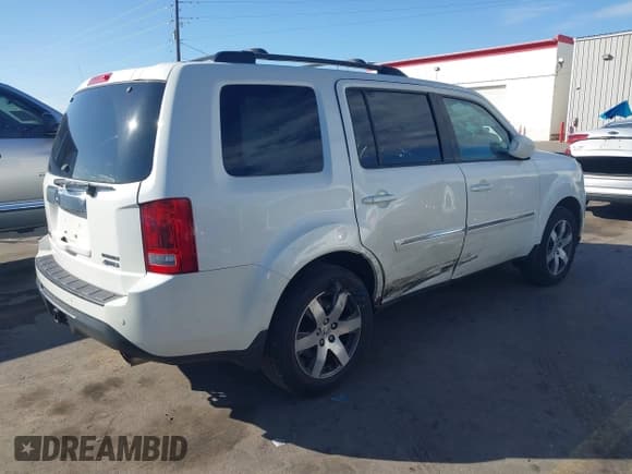 ✅ 2013 Honda Pilot Touring • VIN: 5FNYF4H90DB001880 • Lot: 43519244. Listed on IAAI with 199,875 mi. Free auction sales archive from the USA and detailed vehicle history report at DreamBid. Image 4.