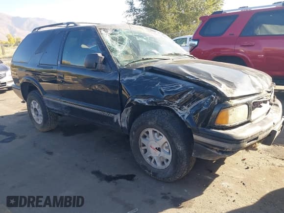 ✅ 1997 GMC Jimmy SLS Comfort/Convenience • VIN: 1GKCT18W3VK516050 • Лот: 43564981. Опубликован ранее на IAAI с пробегом 243 797 миль. Бесплатный доступ к архиву аукционных продаж из США и подробный отчёт об истории автомобиля на DreamBid. Изображение 1.