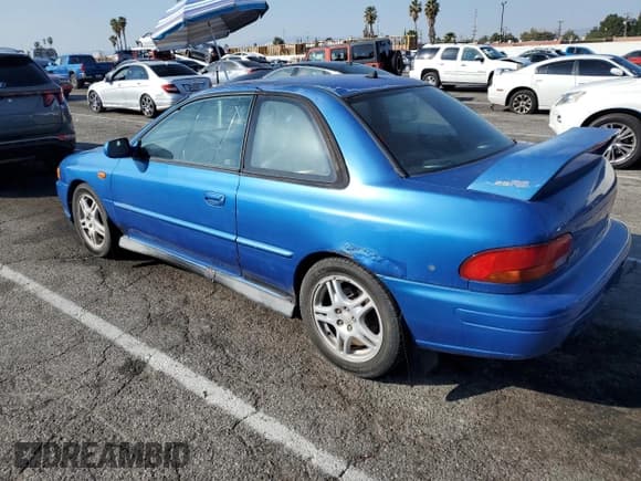 ✅ 1998 Subaru Impreza RS • VIN: JF1GM6757WG401400 • Lot: 43064555. Listed on Copart with 216,443 mi. Free auction sales archive from the USA and detailed vehicle history report at DreamBid. Image 2.