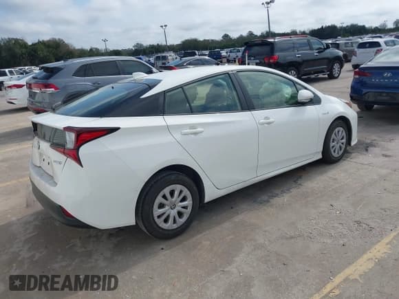 ✅ 2022 Toyota Prius L Eco • VIN: JTDKAMFU8N3184617 • Lot: 41487754. Listed on IAAI with 49,768 mi. Free auction sales archive from the USA and detailed vehicle history report at DreamBid. Image 4.