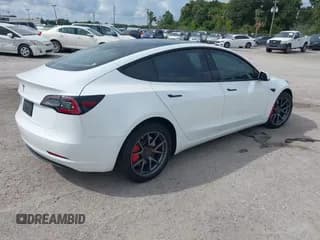 ✅ 2021 Tesla Model 3 Standard Range Plus • VIN: 5YJ3E1EA1MF992100 • Lot: 43225580. Listed on IAAI with 68,544 mi. Free auction sales archive from the USA and detailed vehicle history report at DreamBid. Image 4.