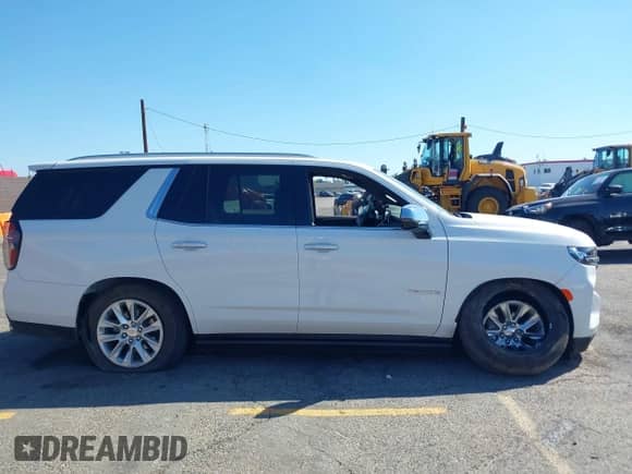 2023 Chevrolet Tahoe Premier z VIN 1GNSKSKD7PR196918, wystawiony jako IAAI lot #43356101 z przebiegiem 13 675 mil mil oraz . Historia ofert i sprzedaży dostępna na DreamBid. Obrazek 13.