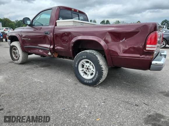 2000 Dodge Dakota Sport z VIN 1B7GG26N5YS650791, wystawiony jako Copart lot #63601765 z przebiegiem 80 841 mil mil oraz Szkoda całkowita • Salvage title. Historia ofert i sprzedaży dostępna na DreamBid. Obrazek 2.