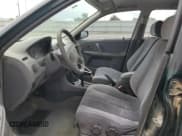 ✅ 1999 Mazda Protege ES • VIN: JM1BJ2210X0150711 • Lot: 57629144. Wystawiony na Copart z przebiegiem 175 754 mil. Bezpłatny archiwum sprzedaży aukcyjnych z USA i szczegółowy raport historii pojazdu na DreamBid. Zdjęcie 7.