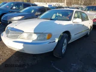 ✅ 2001 Lincoln Continental • VIN: 1LNHM97V71Y670611 • Lot: 41385621. Wystawiony na IAAI z przebiegiem 141 714 mil. Bezpłatny archiwum sprzedaży aukcyjnych z USA i szczegółowy raport historii pojazdu na DreamBid. Zdjęcie 2.
