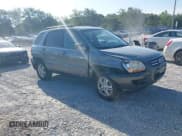 ✅ 2006 Kia Sportage LX • VIN: KNDJF723267292673 • Lot: 42705097. Wystawiony na IAAI z przebiegiem 99 258 mil. Bezpłatny archiwum sprzedaży aukcyjnych z USA i szczegółowy raport historii pojazdu na DreamBid. Zdjęcie 1.