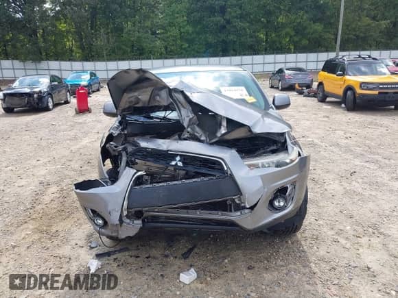 2013 Mitsubishi Outlander ES z VIN 4A4AP3AUXDE020860, wystawiony jako IAAI lot #43064158 z przebiegiem 162 134 mil mil oraz . Historia ofert i sprzedaży dostępna na DreamBid. Obrazek 13.