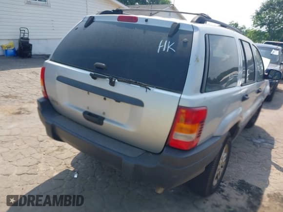 ✅ 2004 Jeep Grand Cherokee Laredo • VIN: 1J4GX48S74C165095 • Lot: 42306475. Listed on IAAI with 238,560 mi. Free auction sales archive from the USA and detailed vehicle history report at DreamBid. Image 4.
