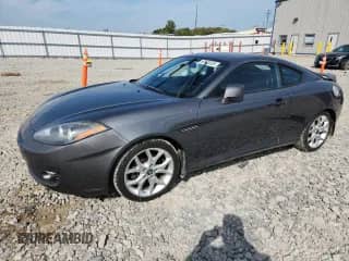 2007 Hyundai Tiburon GT с VIN KMHHN66F37U262161, выставлен на аукционе Copart как лот 80673555 с пробегом 127 895 миль миль и На запчасти • Non repairable. История ставок и продаж доступна на DreamBid. Изображение 1.