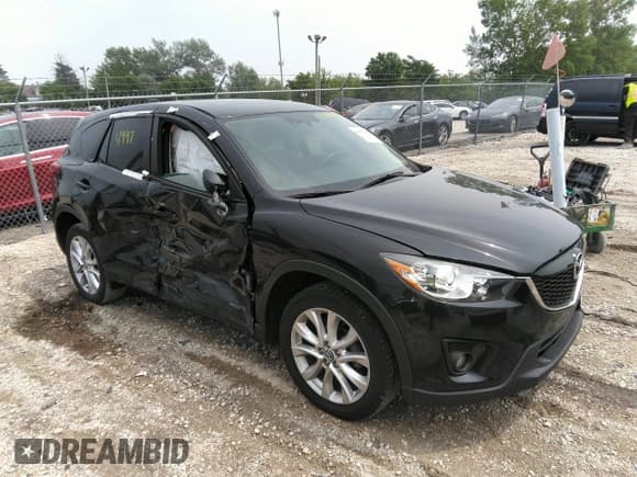 ✅ 2015 Mazda CX-5 Grand Touring • VIN: JM3KE4DY7F0482774 • Lot: 36974997. Listed on IAAI with 82,808 mi. Free auction sales archive from the USA and detailed vehicle history report at DreamBid. Image 1.