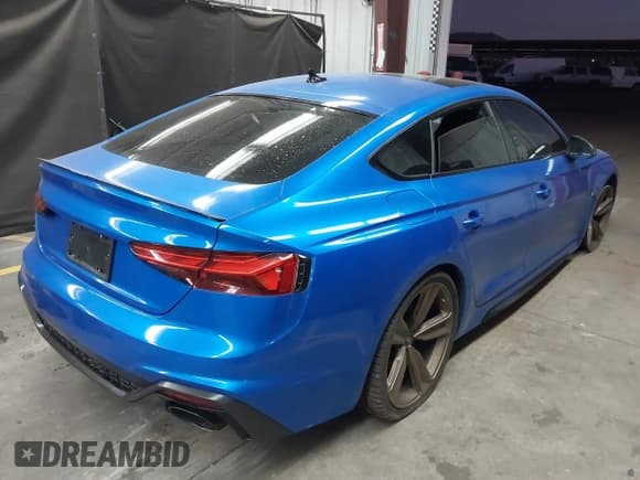 ✅ 2022 Audi RS 5 Sportback • VIN: WUAAWCF51NA902099 • Lot: 43455117. Listed on IAAI with 53,874 mi. Free auction sales archive from the USA and detailed vehicle history report at DreamBid. Image 4.