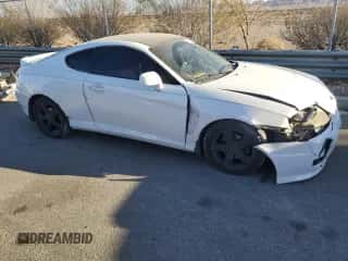 2006 Hyundai Tiburon GT z VIN KMHHN65F26U190479, wystawiony jako Copart lot #87292024 z przebiegiem 141 129 mil mil oraz Szkoda całkowita • Salvage title. Historia ofert i sprzedaży dostępna na DreamBid. Obrazek 4.
