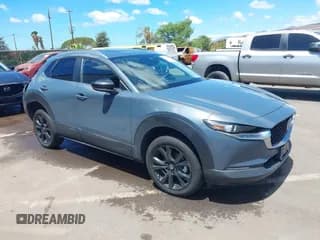 ✅ 2024 Mazda CX-30 S Carbon Edition • VIN: 3MVDMBCM0RM629007 • Lot: 43221200. Listed on IAAI with 14,591 mi. Free auction sales archive from the USA and detailed vehicle history report at DreamBid. Image 1.