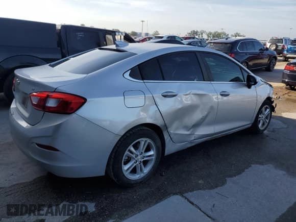 ✅ 2018 Chevrolet Cruze LT • VIN: 1G1BE5SM0J7164843 • Lot: 59765783. Listed on Copart with 65,834 mi. Free auction sales archive from the USA and detailed vehicle history report at DreamBid. Image 3.