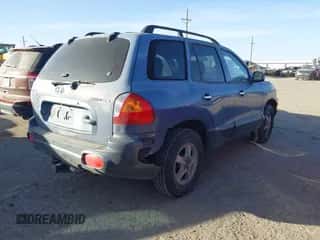 2001 Hyundai Santa Fe GLS z VIN KM8SC83D81U010990, wystawiony jako IAAI lot #41217838 z przebiegiem 171 330 mil mil oraz . Historia ofert i sprzedaży dostępna na DreamBid. Obrazek 4.