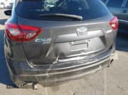 ✅ 2016 Mazda CX-5 Grand Touring • VIN: JM3KE4DY4G0853326 • Lot: 43589595. Wystawiony na IAAI z przebiegiem 69 517 mil. Bezpłatny archiwum sprzedaży aukcyjnych z USA i szczegółowy raport historii pojazdu na DreamBid. Zdjęcie 6.