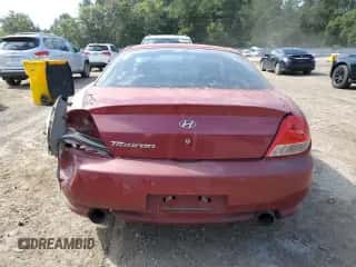 ✅ 2006 Hyundai Tiburon GS • VIN: KMHHM65D46U229462 • Лот: 70912605. Опубликован ранее на Copart с пробегом 169 009 миль. Бесплатный доступ к архиву аукционных продаж из США и подробный отчёт об истории автомобиля на DreamBid. Изображение 6.