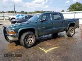 2002 Dodge Dakota SLT с VIN 1B7HG48N12S634155, выставлен на аукционе Copart как лот 71431625 с пробегом 227 575 миль миль и Списание • Salvage title. История ставок и продаж доступна на DreamBid. Изображение 1.