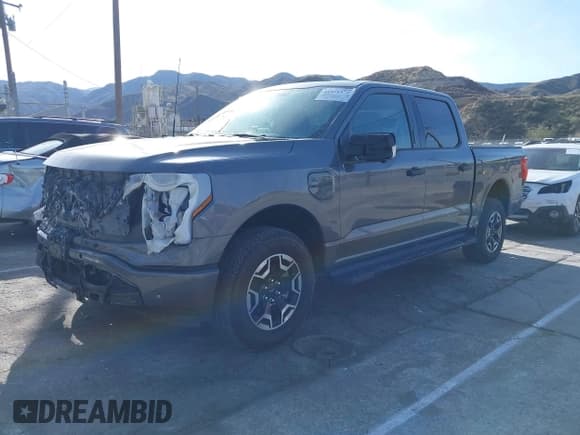✅ 2022 Ford F-150 Lightning Pro • VIN: 1FTVW1EL8NWG09452 • Lot: 41375372. Listed on IAAI with 12,885 mi. Free auction sales archive from the USA and detailed vehicle history report at DreamBid. Image 2.