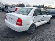 ✅ 2003 Mazda Protege DX • VIN: JM1BJ225331141069 • Лот: 43688727. Опубликован ранее на IAAI с пробегом 136 202 миль. Бесплатный доступ к архиву аукционных продаж из США и подробный отчёт об истории автомобиля на DreamBid. Изображение 4.