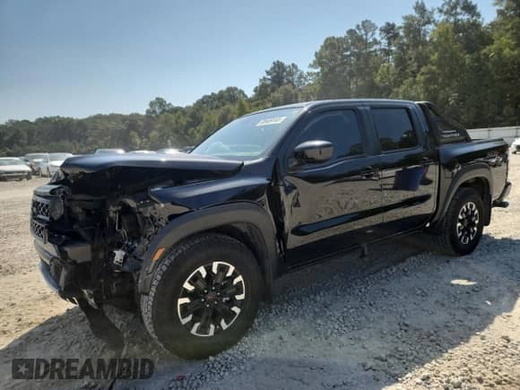2023 Nissan Frontier Pro-X with VIN 1N6ED1EJ8PN643997, listed as a Copart auction lot 80469165 with 24,704 mi miles and Salvage title. Bid and sale history available at DreamBid. Image 1.