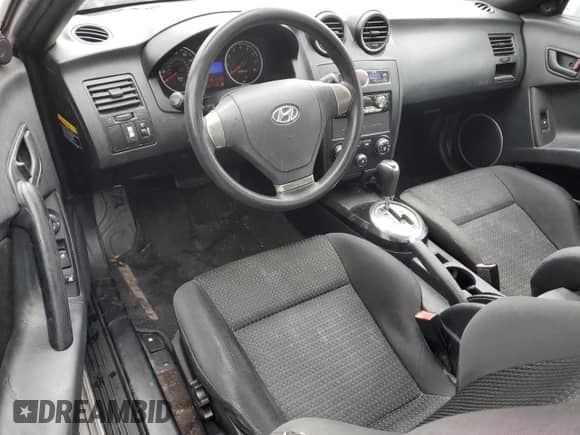 2008 Hyundai Tiburon GS с VIN KMHHM66D68U288062, выставлен на аукционе Copart как лот 58261695 с пробегом 130 310 миль миль и Чистый • Clean title. История ставок и продаж доступна на DreamBid. Изображение 8.