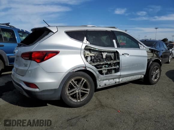 ✅ 2018 Hyundai Santa Fe 2.4L • VIN: 5XYZTDLB9JG549078 • Лот: 71850003. Опубликован ранее на Copart с пробегом Не указан. Бесплатный доступ к архиву аукционных продаж из США и подробный отчёт об истории автомобиля на DreamBid. Изображение 3.