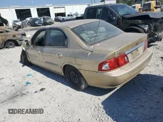 ✅ 2003 Kia Optima LX • VIN: KNAGD126635214280 • Лот: 77695004. Опубликован ранее на Copart с пробегом Не указан. Бесплатный доступ к архиву аукционных продаж из США и подробный отчёт об истории автомобиля на DreamBid. Изображение 2.