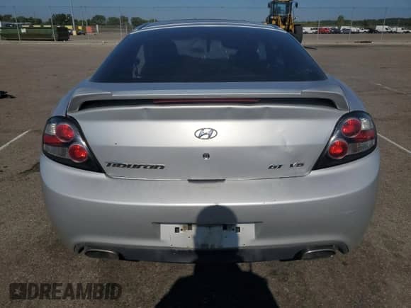2008 Hyundai Tiburon GT z VIN KMHHN66F08U267030, wystawiony jako Copart lot #67479764 z przebiegiem Nie podano mil oraz Szkoda całkowita • Salvage title. Historia ofert i sprzedaży dostępna na DreamBid. Obrazek 6.